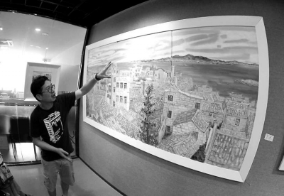 黃瑾毅向記者介紹《海島漁村》。